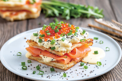 Crispy wonton layers stacked with scrambled eggs and sliced smoked salmon, topped with warm queso blanco, salmon roe, chopped chives, and everything bagel seasoning.
